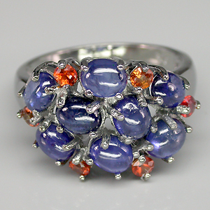 Кольцо с кабошонами синих и оранжевыми сапфирами