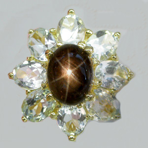 Кольцо со звездчатым сапфиром и топазами