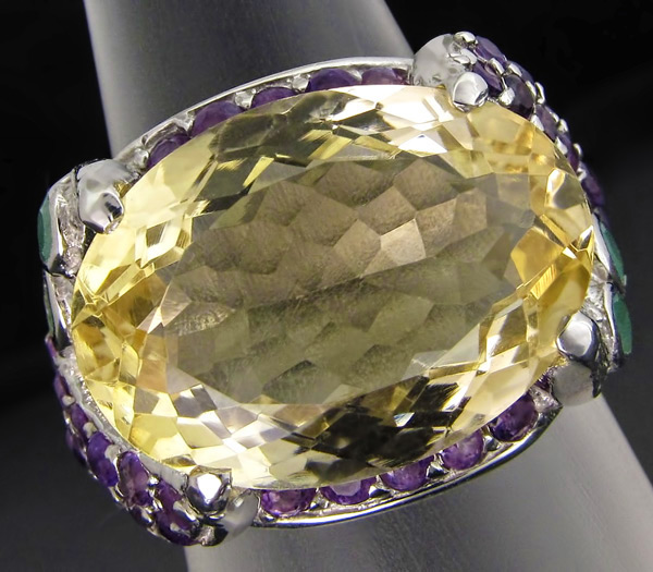 Кольцо с цитрином, аметистами и изумрудами