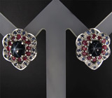 Серьги со звездчатыми, пурпурными и синими сапфирами Серебро 925