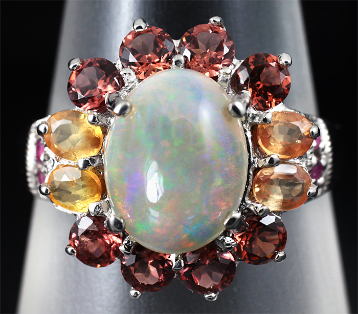 Кольцо с эфиопским опалом, гранатами и сапфирами