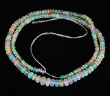 185 эфиопских опалов 35+ карат на нити 