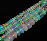 185 эфиопских опалов 35+ карат на нити 