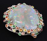 Кулон с окаменевшим опализированным моллюском, цаворитами и разноцветными сапфирами