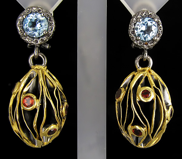 Серьги из серебра 925 пробы с топазами и гранатами.