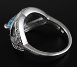 Эффектное серебряное кольцо с голубым топазом