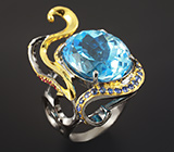 Серебряное кольцо с голубым топазом, синими сапфирами и рубинами