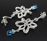 Эффектные серебряные серьги с бриолетами голубых топазов