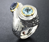 Серебряное кольцо с лабрадоритом и голубыми топазами