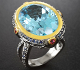 Серебряное кольцо с голубым топазом, рубинами и синими сапфирами Серебро 925