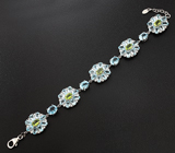 Замечательный серебряный браслет с перидотами и голубыми топазами Серебро 925