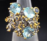 Серебряное кольцо с голубыми топазами и синими сапфирами