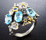 Серебряное кольцо с голубыми топазами и синими сапфирами Серебро 925