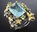 Серебряное кольцо с голубым топазом и перидотами Серебро 925