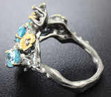 Серебряное кольцо с голубыми топазами и синими сапфирами