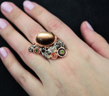 Серебряное кольцо с силлиманитом с эффектом «кошачьего глаза», цаворитами и перидотами Серебро 925