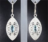Крупные ажурные серебряные серьги с голубыми топазами