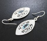 Крупные ажурные серебряные серьги с голубыми топазами