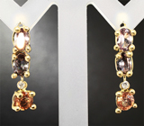 Золотые серьги с гранатами со сменой цвета 3,77 карат и бриллиантами Золото