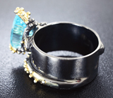 Серебряное кольцо с голубым топазом лазерной огранки, родолитом и аметистами Серебро 925
