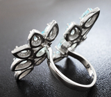 Необычное серебряное кольцо с голубыми топазами Серебро 925