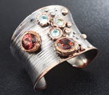 Серебряное кольцо с мозамбикскими гранатами и голубыми топазами Серебро 925