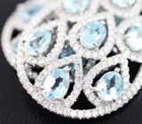 Крупные ажурные серебряные серьги с голубыми топазами