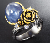 Серебряное кольцо с синим сапфиром и танзанитами