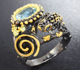 Серебряное кольцо с голубым топазом, перидотами и синими сапфирами Серебро 925