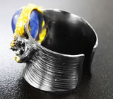 Серебряное кольцо с синим сапфиром и родолитами