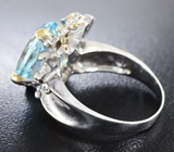 Серебряное кольцо с голубым топазом и гранатами Серебро 925
