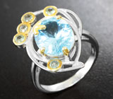 Серебряное кольцо с голубым топазом и зелеными сапфирами