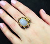Серебряное кольцо с голубым халцедоном и сапфирами