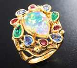 Массивное золотое кольцо с топовым ограненным опалом 3,72 карат, изумрудами, синими и оранжевыми сапфирами Золото