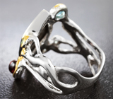 Серебряное кольцо с аммолитом аммонита, голубым топазом, родолитом и цаворитами Серебро 925
