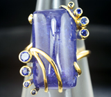 Золотое кольцо с крупным танзанитом 22,9 карата и синими сапфирами Золото
