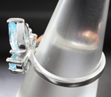 Прелестное серебряное кольцо с голубыми топазами Серебро 925