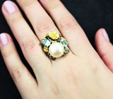 Серебряное кольцо с жемчужиной и голубыми топазами