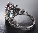 Серебряное кольцо с голубым топазом, родолитом и аметистами Серебро 925