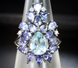 Эффектное серебряное кольцо с голубым топазом и танзанитами Серебро 925