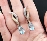 Изысканные серебряные серьги с голубыми топазами Серебро 925