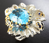 Серебряное кольцо с голубым топазом лазерной огранки 15,92 карата и синими сапфирами