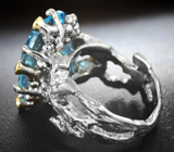 Серебряное кольцо с голубым топазом лазерной огранки 15,48 карата и синими сапфирами