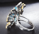 Серебряное кольцо с голубым топазом лазерной огранки 12,58 карата и танзанитами Серебро 925