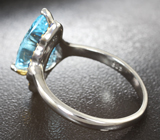 Серебряное кольцо с голубым топазом лазерной огранки 5,28 карата и синими сапфирами Серебро 925