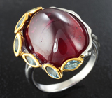 Серебряное кольцо с рубином 24,4 карата и голубыми топазами Серебро 925