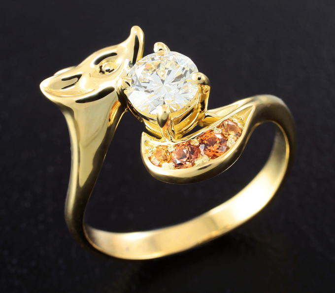 Кольцо с бриллиантом 0,5 карата и оранжевыми сапфирами