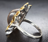 Серебряное кольцо с кабошоном турмалина 16,48 карата и золотистыми турмалинами