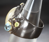 Серебряное кольцо с рутиловым кварцем, голубым топазом и перидотами Серебро 925