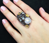 Серебряное кольцо с лунным камнем, голубыми топазами и родолитами 